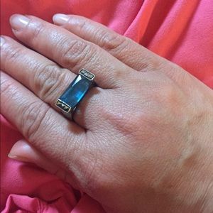 Silver ring with details in front.